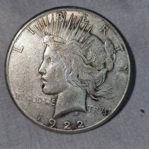lot 24 image: 1922 S Morgan Dollar $1 in V.F. Condition