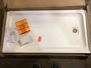 lot 60 image: MAAX Olympia 60 in. x 32 in. Single Threshold Acrylic Shower Base with Left Drain in White Damaged Customer Returns See Pictures