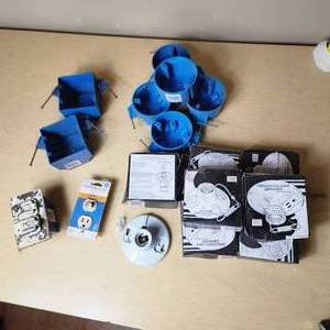 lot 19 image: Lot of Electrical Supplies Including Porcelain Pull Chain Lampholders, GE Wall Switch Outlet, and Electrical Boxes