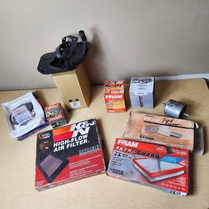 lot 30 image: Assorted Automotive Filters and Parts including K&N High-Flow Air Filter, FRAM Oil Filters, and Wix Fuel Filter - See Pics