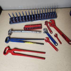 lot 98 image: Lot of Assorted Hand Tools Including Adjustable Wrenches, Nippers, Socket Holders, and Pliers