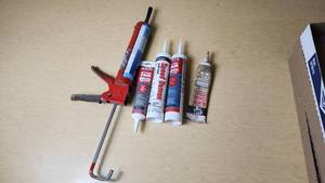lot 285 image: Caulking Gun and Sealant Lot including Red Devil Speed Demon, DAP Kwik Seal Plus, and Other Sealants