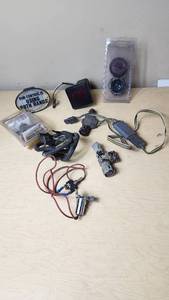 lot 327 image: Assorted Vehicle Electrical Components and Accessories including Wiring Harnesses, Connectors, and Decorative Items