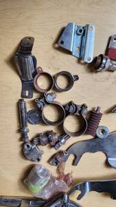 Harley Davidson and Other Motorcycle Parts Set including Sportster Seat, Backrest, and Various Accessories