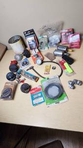 lot 342 image: Assorted Automotive Parts Lot including Dorman Sending Unit Retainers, Autolite Spark Plugs, and Anti-Theft Door Lock Knobs