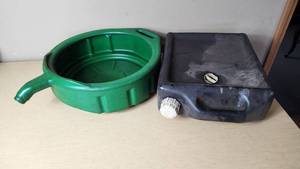 lot 376 image: Green oil drain pan and black oil storage container