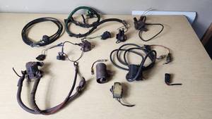 lot 381 image: Assorted Automotive Electrical Components including Wiring Harnesses, Relays, and Connectors