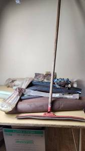 lot 399 image: Assorted Construction and Plumbing Supplies including Squeegee, Fuel Tank Strap, Heating Tape, and Insulation Rolls