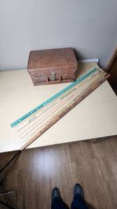 lot 468 image: Leather Case with Cassette Tapes (Kenny Rogers, MC Hammer, Footlose) and Yardsticks