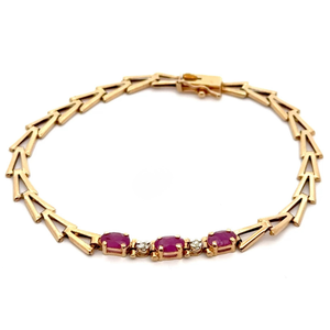 lot 35 image: Ruby Three-Stone Fancy Link Bracelet in Yellow Gold VIDEO