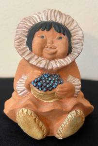 lot 57C image: P - 4.5 Inch Signed Pueblo Pottery Figure Child Holding Basket