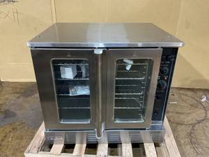 lot 1 image: Magic Chef 38 in. Commercial Convection Oven in Stainless Steel (Missing Legs and Wheels)