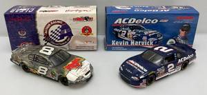 lot 59 image: Misc. NASCAR 124 Scale Die Cast Stock Cars Kevin Harvick &amp Dale Jr. Clear Stock Car in Original Boxes