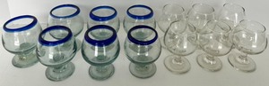 lot 214 image: Hand blown cobalt-blue rim brandy snifters and clear stemmed glasses.&nbsp