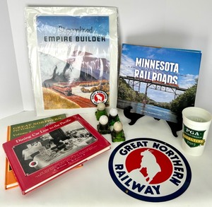 lot 218 image: Railroad Memorabilia Lot - Great Northern Railway Books &amp Enamel Sign &amp Lamps
