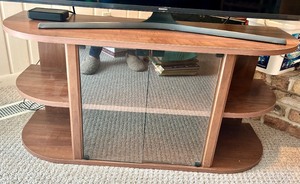 lot 235 image: TV Stand - Wood Veneer, Glass Front Center, Curved Shelves