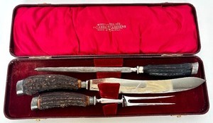 lot 240 image: Vintage Wostenholms Celebrated Carvers carving set in a red leather case.