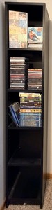 lot 49 image: CDs & DVDs Lot with Tall Black Cabinet for storage. Featuring a collection by Jimmy Buffett & other various artists
