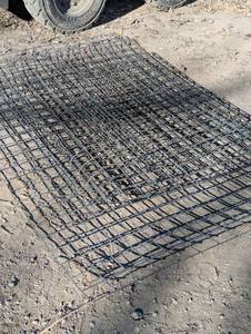 lot 40 image: Four panels of garden fence 8 ft. X5 ft. Two of the panels are rolled