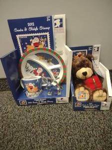 lot 66 image: USPS 2012 Santa and Sleigh, Teddy Bear. No Stamps Plushie, plate, cup, cookiee cutter
