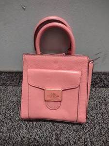 lot 74 image: Pink Coach Handbag