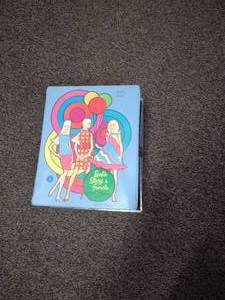 lot 36 image: Vintage Barbies Carying case Clothes