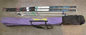 lot 665K image: G - Trak Spectrum Cross Country Skis with Salomon Bindings, Poles, and Exel 80 Case