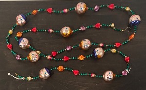 lot 498R image: S - Glass Garland with Hand-Painted Faces and Colorful Beads