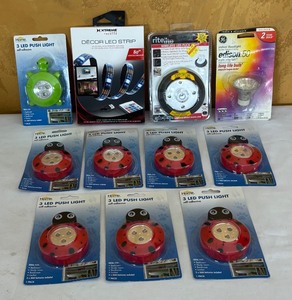 lot 699R image: MB - Lot of LED Push Lights, LED Strip Light, Wireless Puck Light and Floodlight Bulb