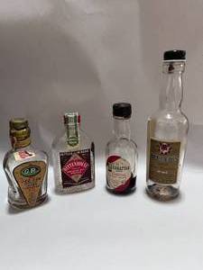 lot 13 image: Four 1930s Miniature Liquor Bottles Kings Deluxe Walkers Vodka