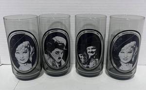 lot 111 image: 1979 Arbys Collector Glasses #1,3,and 4 Laurel and Hardy, Mae West Charlie Chaplin