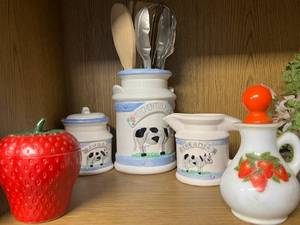 lot 99 image: Cow-Themed Ceramic Kitchen Set and Strawberry Jar Collection