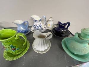 lot 109 image: Set of Assorted Vintage Miniature Porcelain Pitchers with Saucers