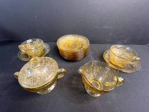 lot 114 image: Amber Depression Glass Tea Set with Cups, Saucers, Sugar Bowl and Creamer