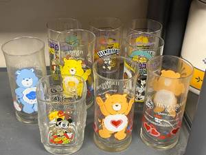lot 120 image: Collection of Vintage Character Glasses Care Bears Flintstones Mickey Mouse