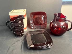 lot 165 image: Avon 1876 Cape Cod Collection Ruby Red Glass Pitchers and Plates Set