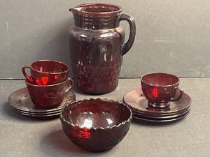 lot 166 image: Vintage Ruby Red Glass Pitcher Set with Cups, Saucers, and Bowl