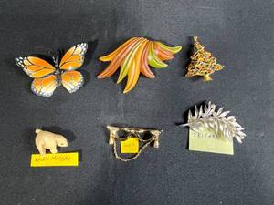 lot 211 image: Collection of Vintage Costume Jewelry Brooches Including Trifari, Avon, and Ralph Massey