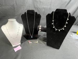 lot 215 image: Sterling Silver Jewelry Set with Necklaces and Holiday Brooches