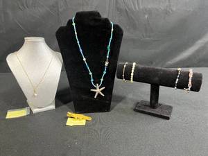 lot 217 image: Jewelry Collection with Beaded Necklaces, Bracelets, and Gold-Tone Crocodile Pin