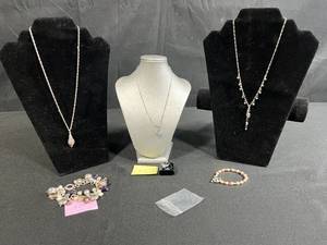 lot 222 image: Sterling Silver Jewelry Collection with Necklaces, Bracelets, and Dark Gray Stone Ring
