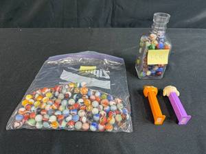 lot 67 image: Collection of Vintage Marbles in Glass Bottle and Bag with 2 Pez Dispensers
