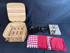 lot 75 image: Picnic Basket Set with Black Speckled Dishes, Red Napkins, and Giraffe Art