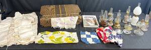 lot 161 image: Antique Lot with Oil Lamps, Textiles, Suitcase, and Encyclopedia