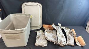 lot 195 image: Gray Storage Tote with Lid and Assorted Tree Bark Pieces