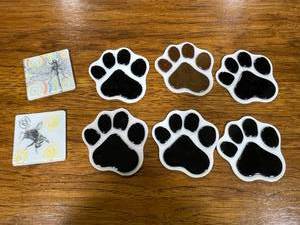lot 203 image: Set of 8 Glass Coasters with Paw Print and Insect Designs