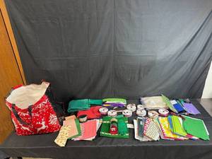 lot 142 image: Large Lot of Gift Wrapping Supplies with Ribbons, Tissue Paper, Bags, and More