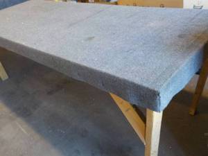 lot 02 image: 8 Foot long carpet top work counter, 36 high, very sturdy perfect for multi use shop space