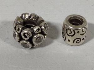lot 6 image: Two Pandora Sterling Silver Charms