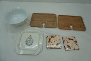 lot 126 image: Bamboo CuttingServing Boards, Lefse Coasters, Spoon Plate, Porcelain Bowl 8 diameter 3.5 tall